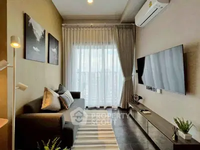 Modern living room with sleek furniture and large window, perfect for cozy relaxation.