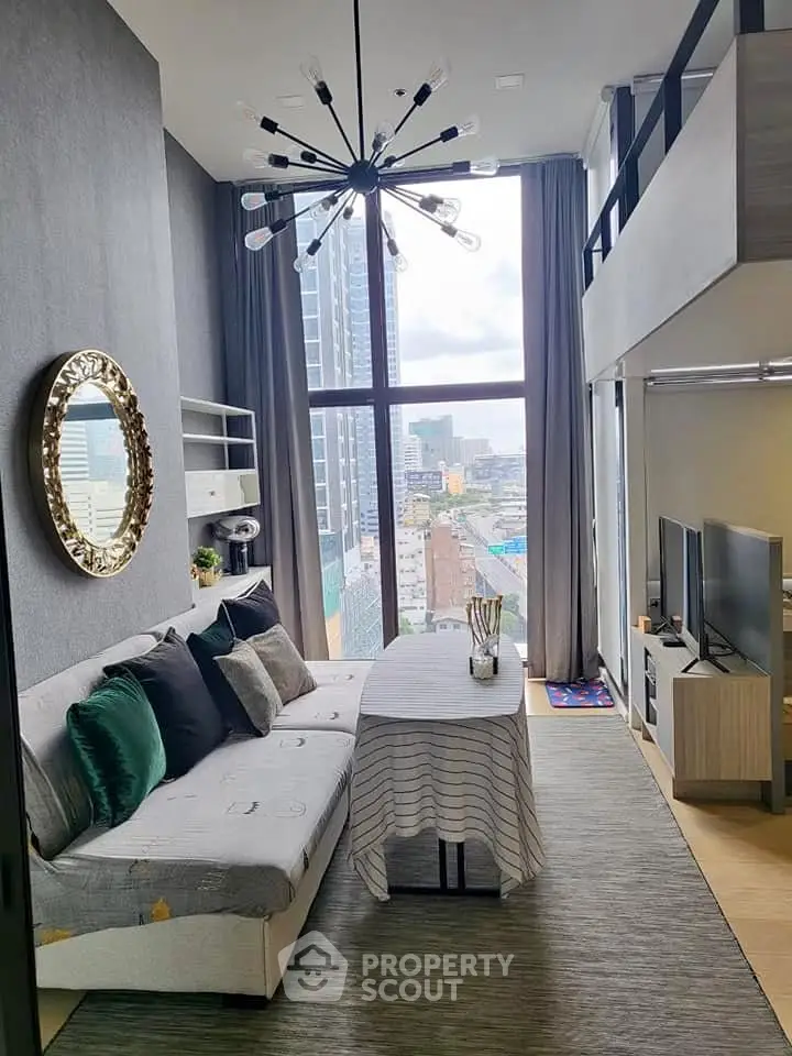 Modern loft-style living room with high ceilings and city view, featuring chic decor and ample natural light.