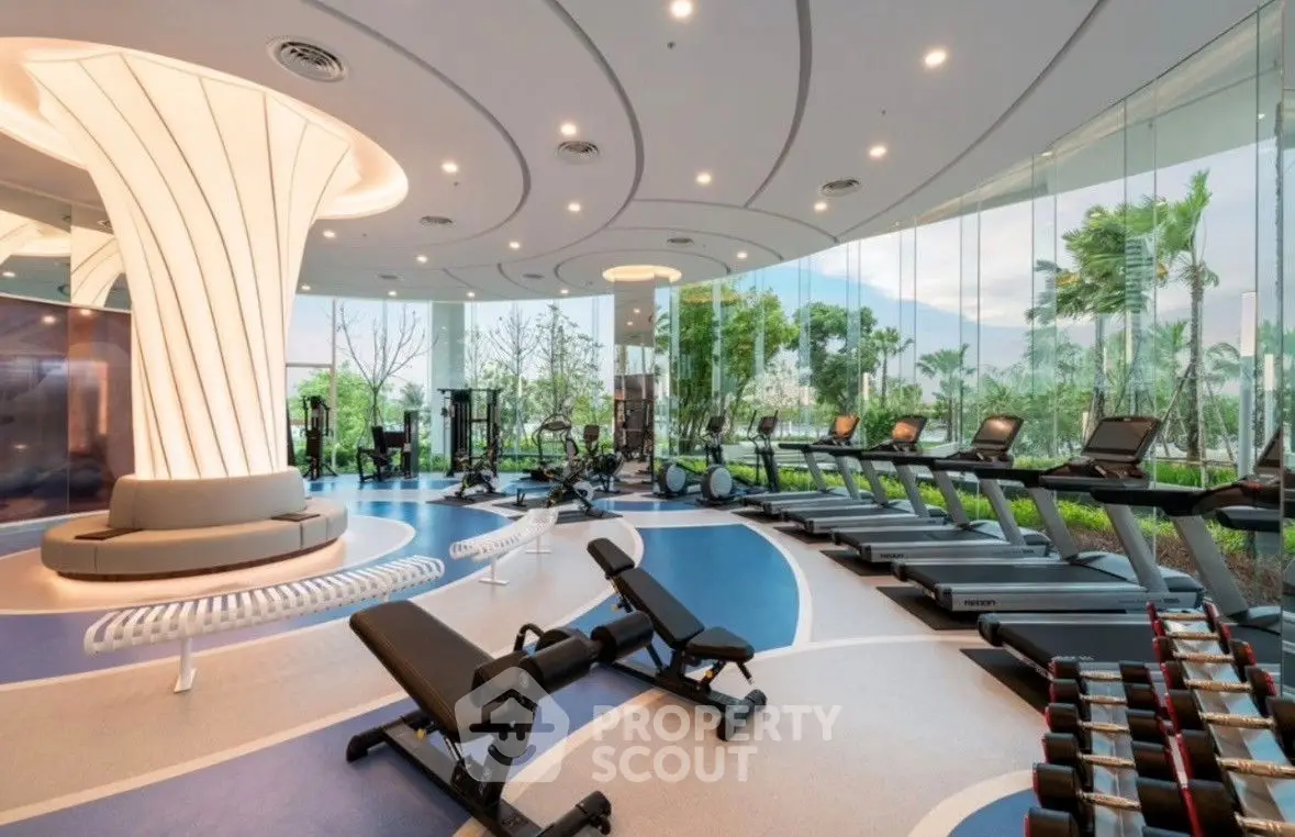Luxurious modern gym with panoramic garden views and state-of-the-art equipment.