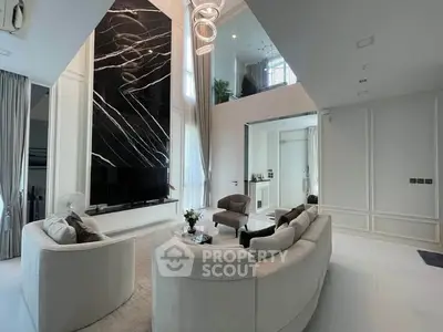 Luxurious modern living room with high ceilings and elegant decor