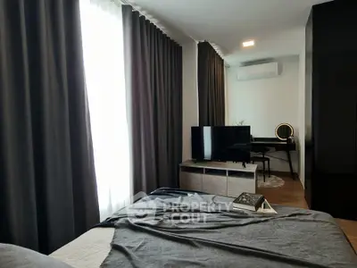 Modern bedroom with stylish decor and natural light