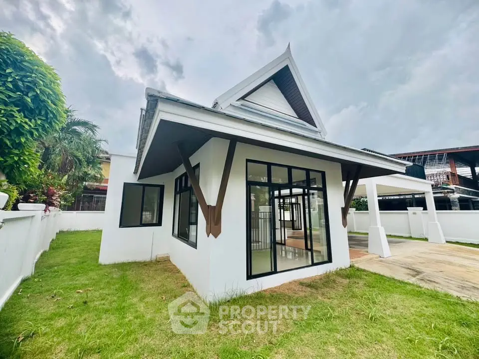 Charming modern house with unique architectural design and lush green lawn