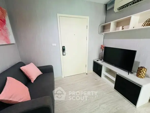 Cozy living room with modern decor and wall-mounted TV