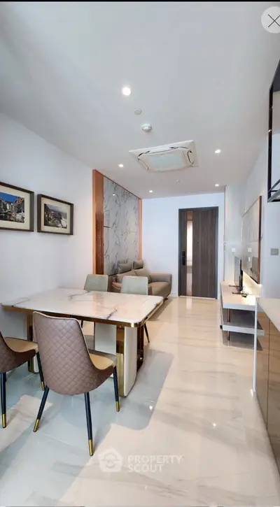 Modern living room with elegant dining area and stylish decor