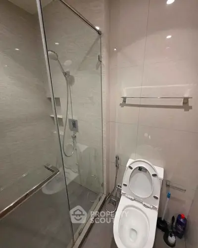 Modern bathroom with glass shower and sleek toilet design