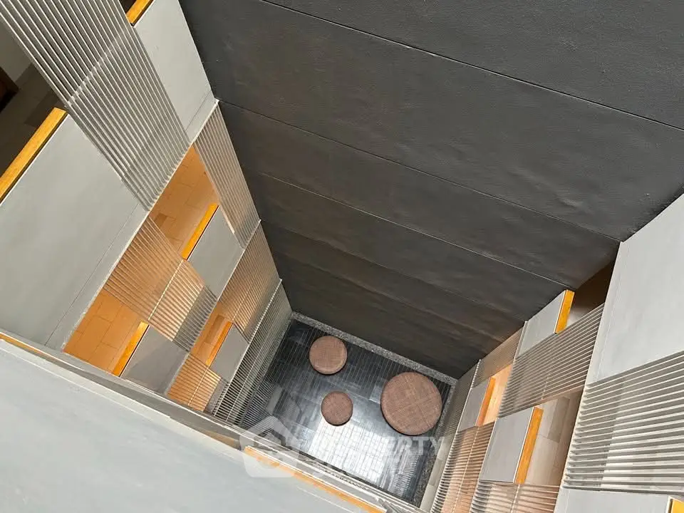 Modern building interior with unique architectural design and open atrium view.
