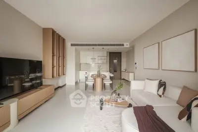 Modern living room with sleek furniture and open kitchen layout, perfect for contemporary living.