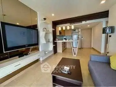 Modern living room with open kitchen and stylish decor in a contemporary apartment.