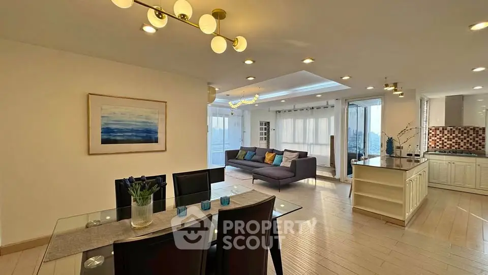 Spacious open-plan living and dining area with modern decor and ample natural light.