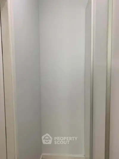 Minimalist white storage space with clean lines and modern design.