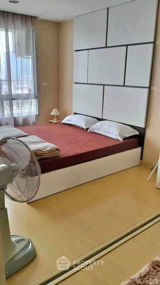 Modern bedroom with stylish decor and natural light