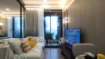 Modern living room with cozy decor and large windows