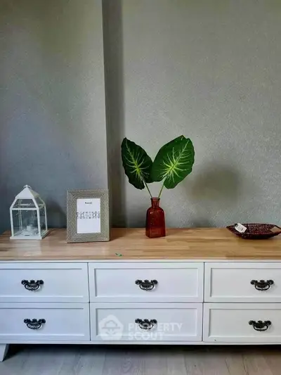 Elegant interior with stylish sideboard and decorative accents in modern living room.