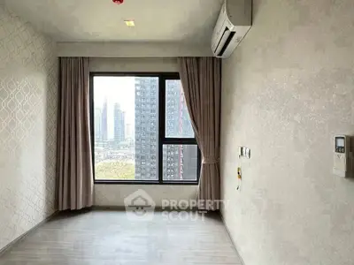 Modern empty room with large window and city view, featuring air conditioning and elegant curtains.