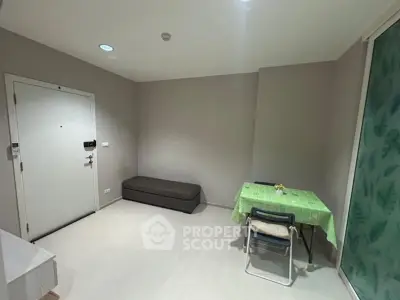Minimalist interior with small dining area and seating, ideal for compact living spaces.