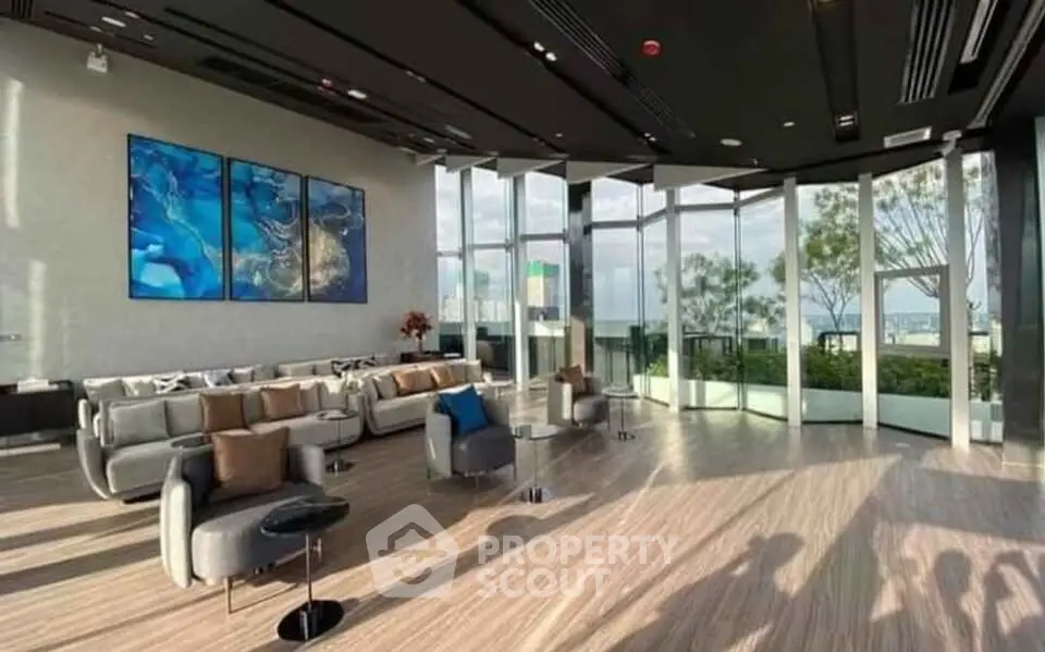 Luxurious modern living room with floor-to-ceiling windows and stunning views, perfect for relaxation and entertainment.