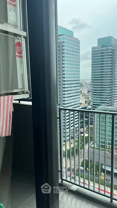 Stunning city view from a modern high-rise balcony, perfect for urban living.