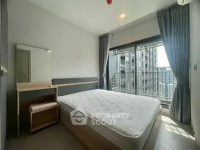 Modern bedroom with large window and city view in high-rise apartment