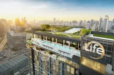 Stunning rooftop pool with panoramic city views in luxury high-rise building.