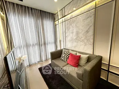 Stylish living room with modern sofa and elegant curtains, perfect for cozy relaxation.