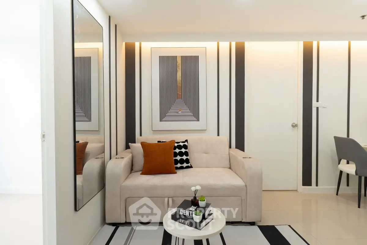 Modern living room with stylish decor and cozy seating area, perfect for relaxation and entertaining.