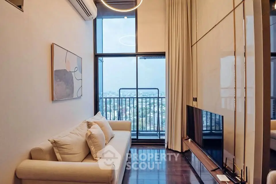Modern living room with balcony and city view, featuring sleek design and cozy ambiance.