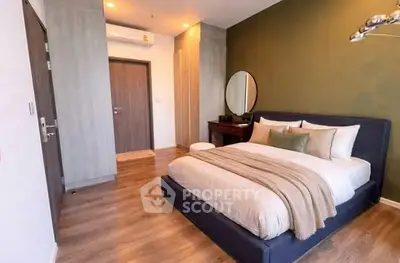 Modern bedroom with stylish decor and cozy ambiance in a contemporary apartment.