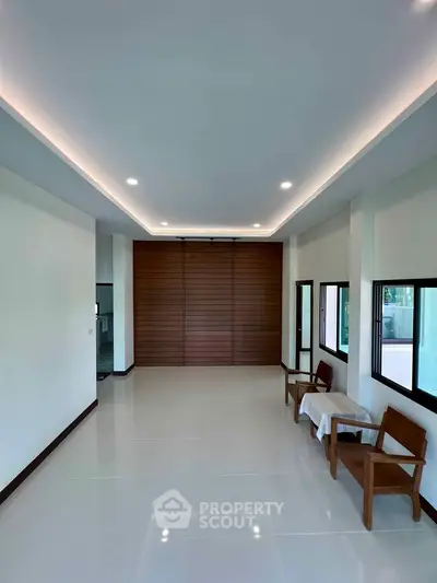 Spacious modern living room with sleek design and natural light