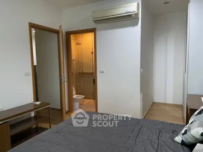 Modern bedroom with ensuite bathroom and air conditioning