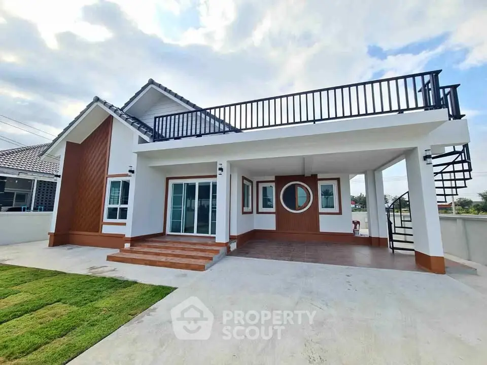 Modern two-story house with spacious rooftop terrace and elegant exterior design.