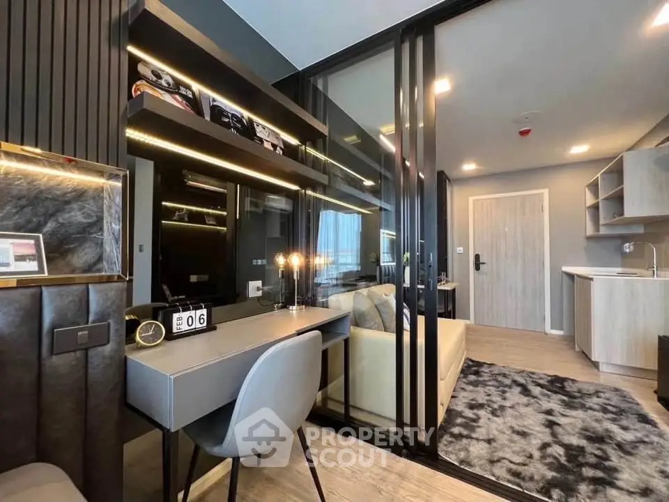 Modern living room with sleek design and open layout, featuring stylish furniture and ambient lighting.