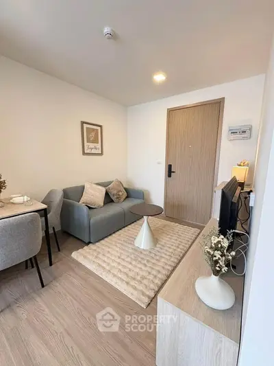 Modern living room with cozy sofa and stylish decor in a contemporary apartment.