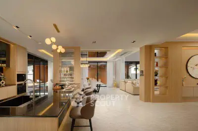 Luxurious open-plan living room with modern kitchen and elegant decor