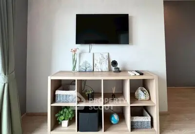 Modern living room with stylish TV stand and decor accents