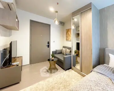 Modern studio apartment with cozy living area and stylish decor