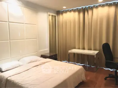 Spacious bedroom with elegant curtains and modern furnishings