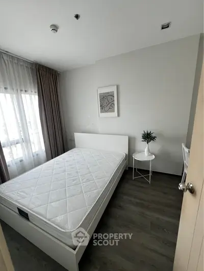 Modern minimalist bedroom with natural light and stylish decor