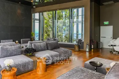 Luxurious modern living room with panoramic city views and plush seating