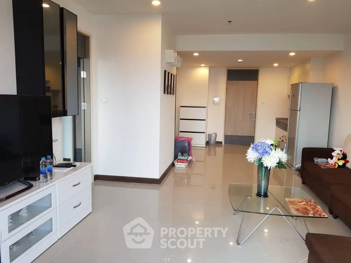 Modern living room with sleek furniture and open layout in a stylish apartment.