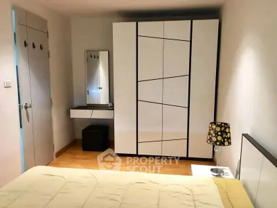 Modern bedroom with stylish wardrobe and cozy lighting