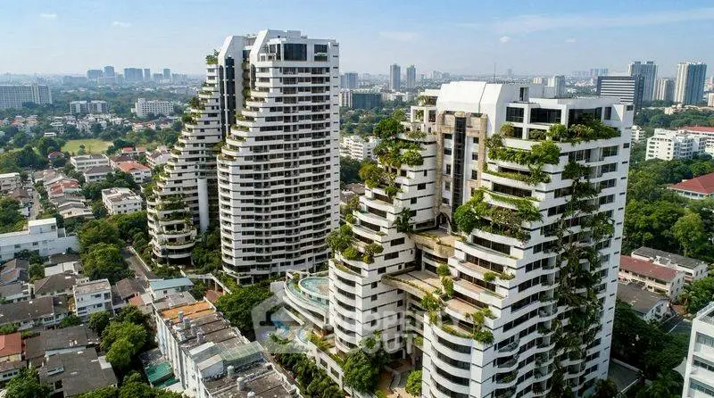 Luxurious high-rise buildings with lush greenery and stunning city views.