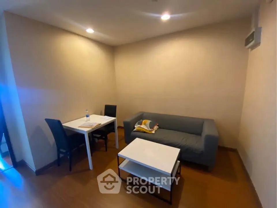 Cozy living room with modern furniture and warm lighting, perfect for relaxation and entertainment.