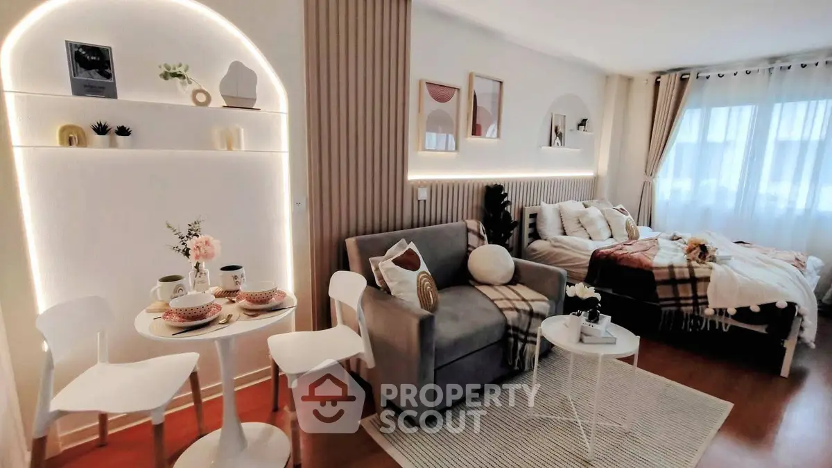Chic studio apartment with cozy living area and stylish decor