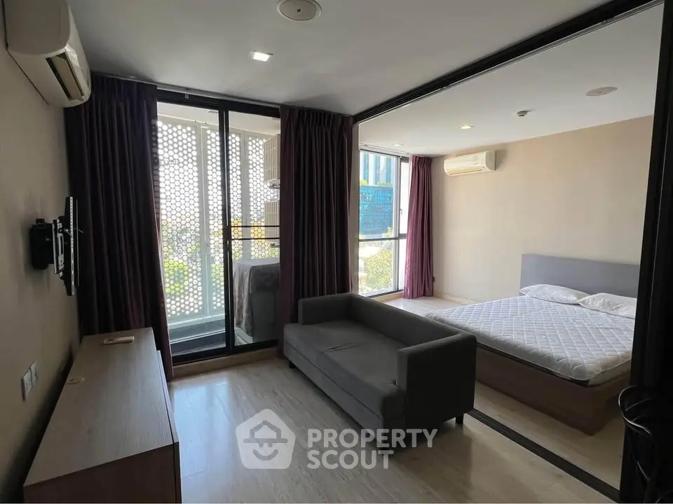 Modern studio apartment with balcony and stylish interior design