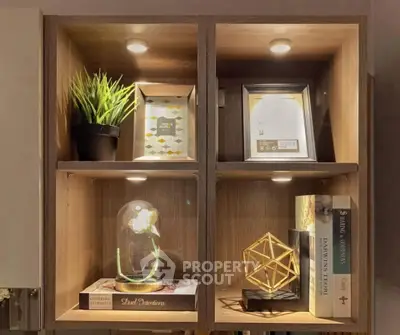 Stylish wooden shelving unit with decorative items and books, perfect for modern living room decor.