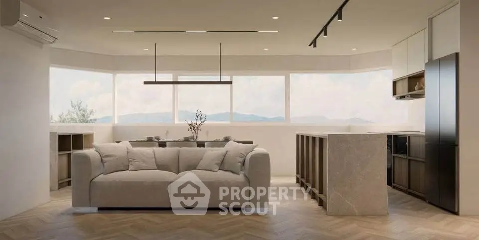 Spacious modern living room with panoramic windows and elegant kitchen island