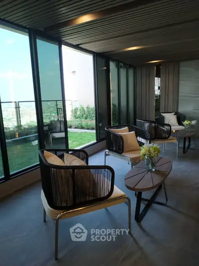 Stylish balcony with modern seating and garden view in luxury apartment