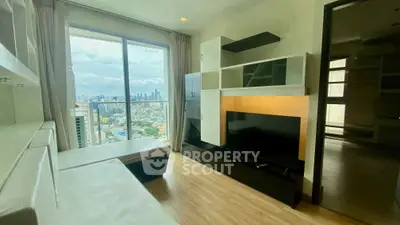 Modern living room with city view and sleek entertainment unit