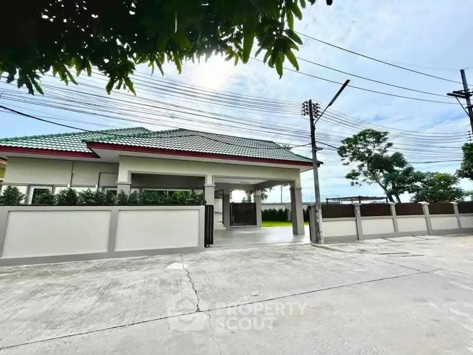 Charming suburban home with green roof and spacious driveway