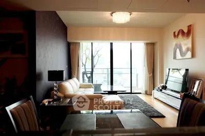 Luxurious living room with modern decor and stunning city view from large windows.